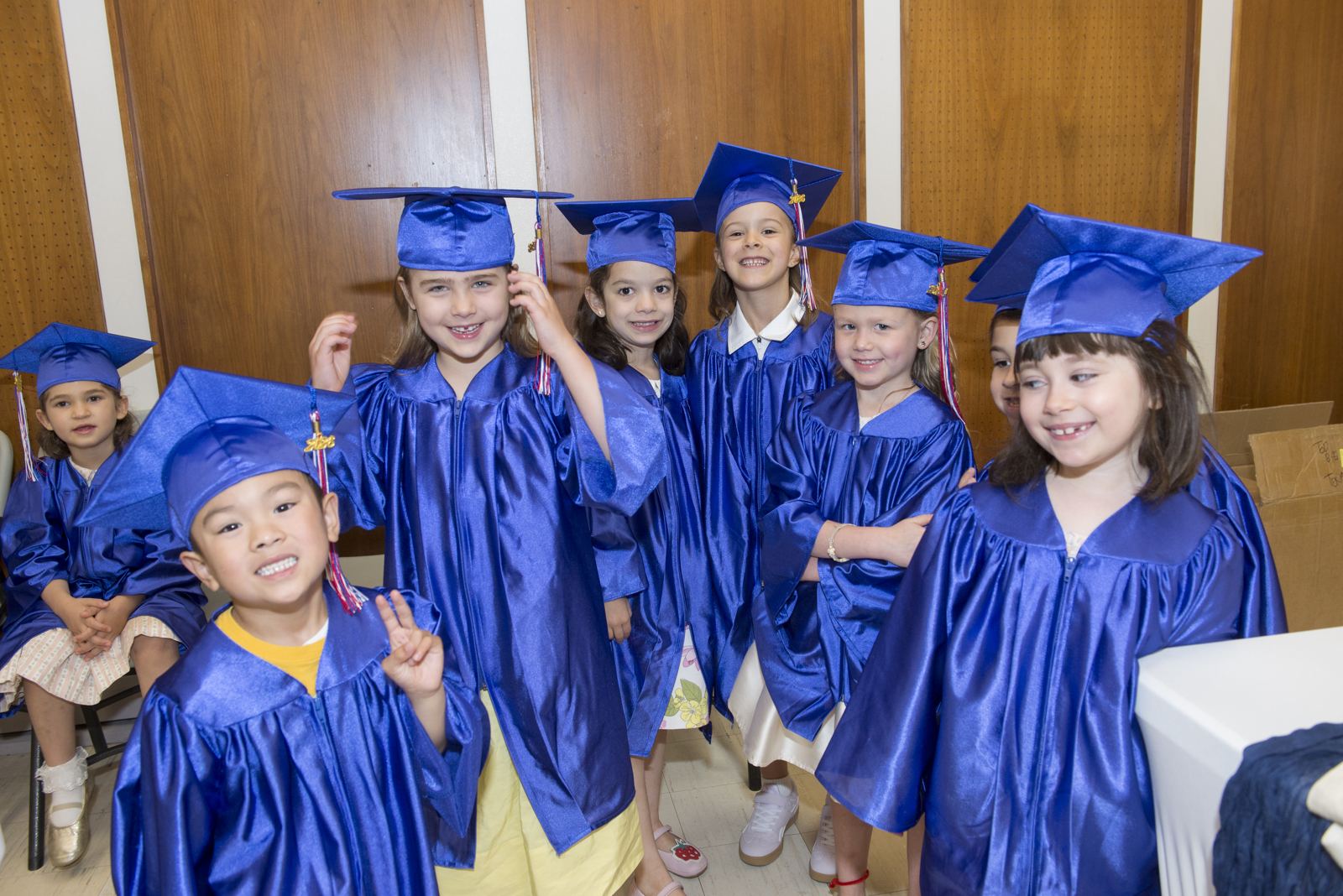 Smiling Lycée Français de Toronto Kindergarten students in blue gowns